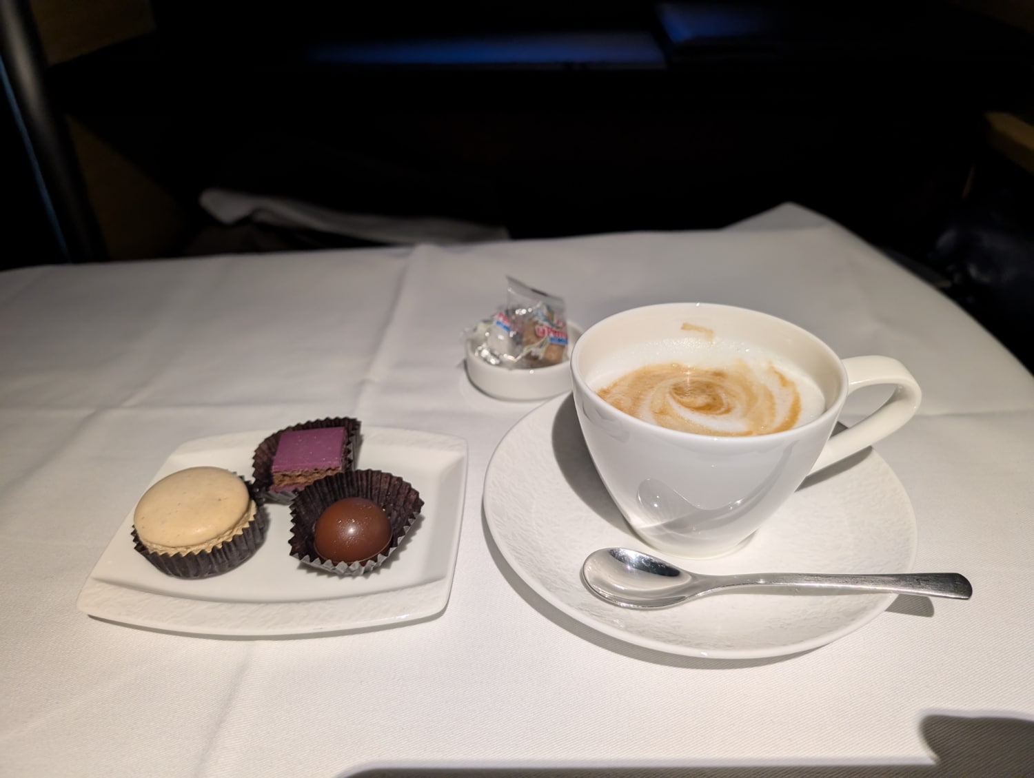 ana first class 777-300er cappucino with small chocolates