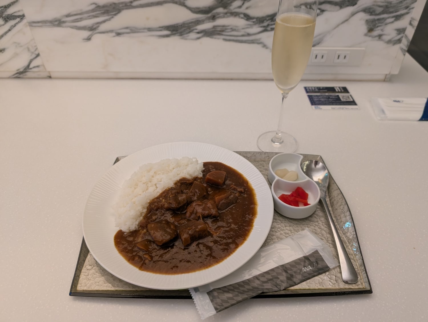 chicken curry and champagne at ana suite lounge tokyo haneda aiport
