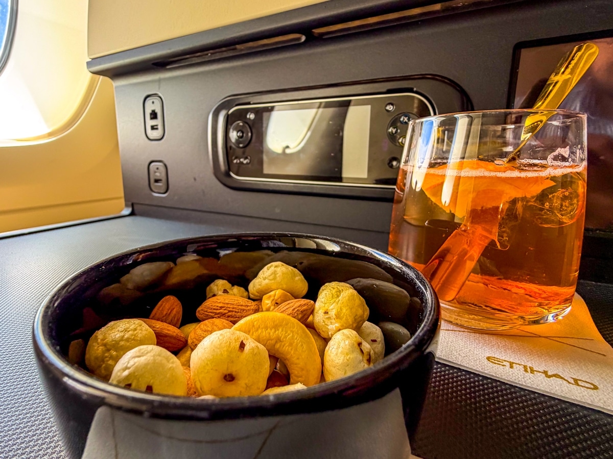 etihad airways business class a380 old fashioned cocktail with nuts