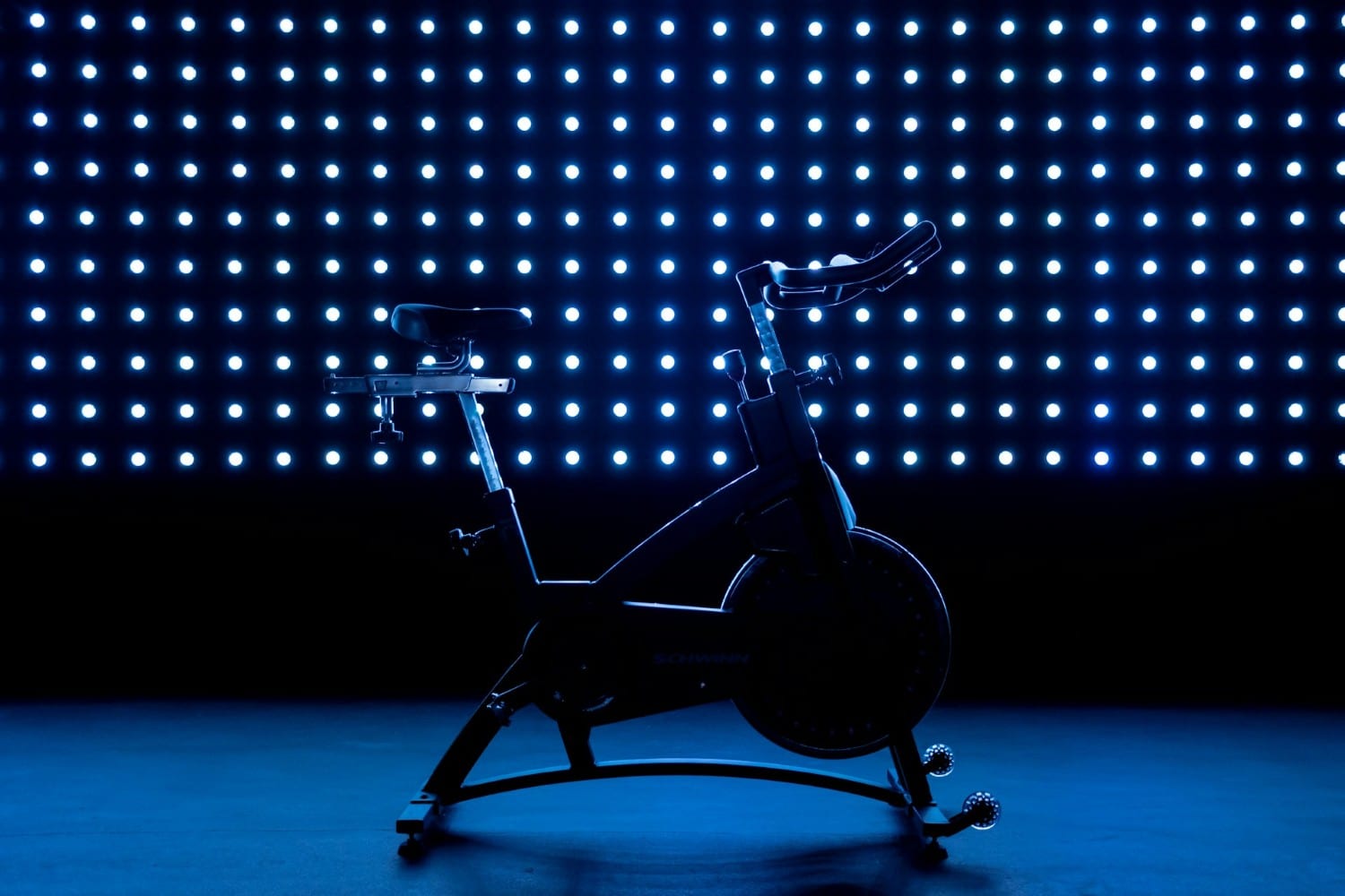 peloton bike in a dimly lit studio