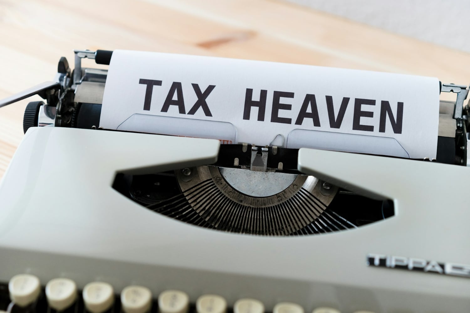 tax heaven written on a sheet of paper in a typewriter