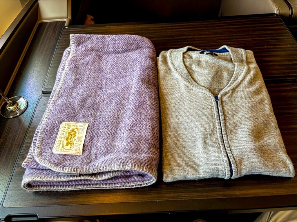 ana the suite first class blanket and cardigan