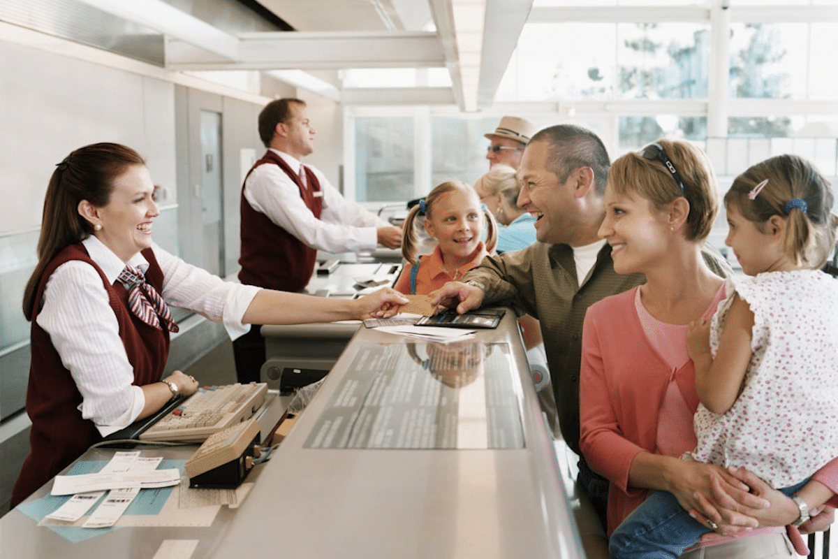 family checking in at airport