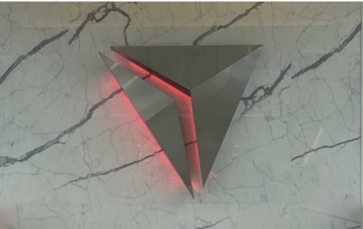 stainless steel delta logo on marble wall