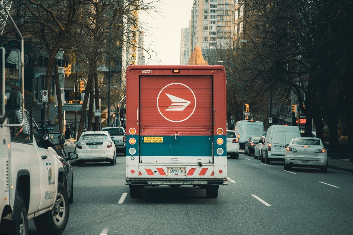 canada post delivery truck on road