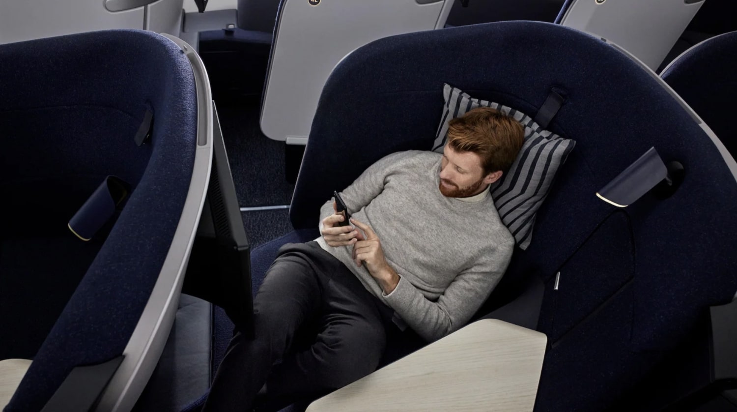 person sitting in finnair business class pod